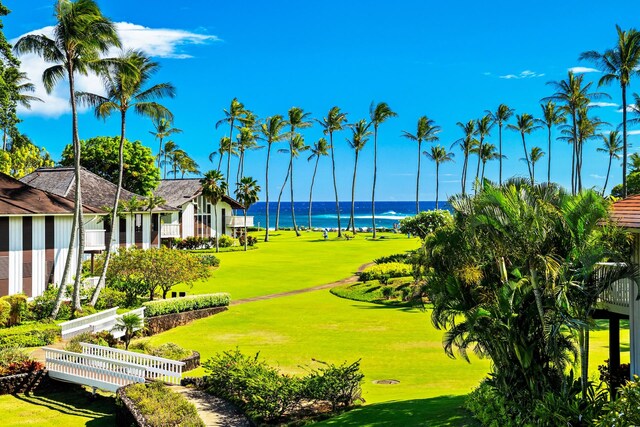 2253 Poipu Rd Unit 77, Koloa, HI 96756 - view of home's community featuring a water view, a lawn, and golf course view