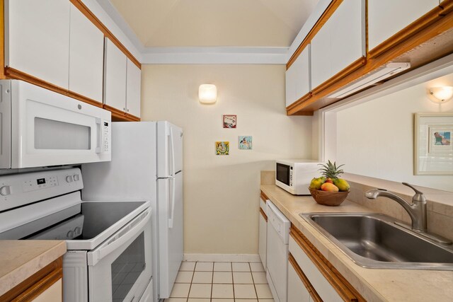 2253 Poipu Rd Unit 77, Koloa, HI 96756 - kitchen with white appliances, a sink, white cabinets, light countertops, and light tile patterned floors