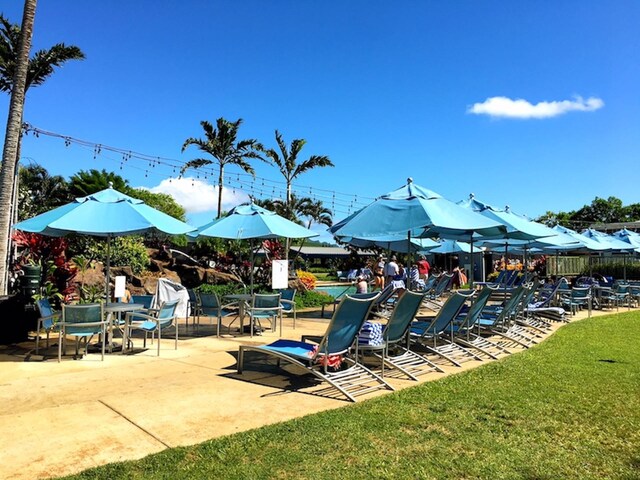 2253 Poipu Rd Unit 77, Koloa, HI 96756 - view of play area with a patio and a lawn