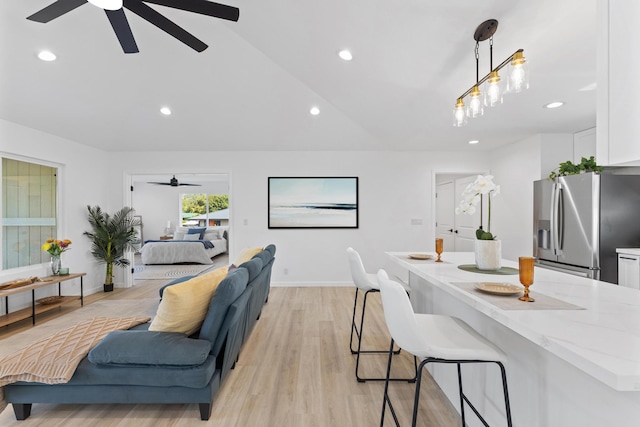 15-1499 23rd Ave, Keaau, HI 96749 - living area featuring a ceiling fan, recessed lighting, light wood-style floors, baseboards, and vaulted ceiling