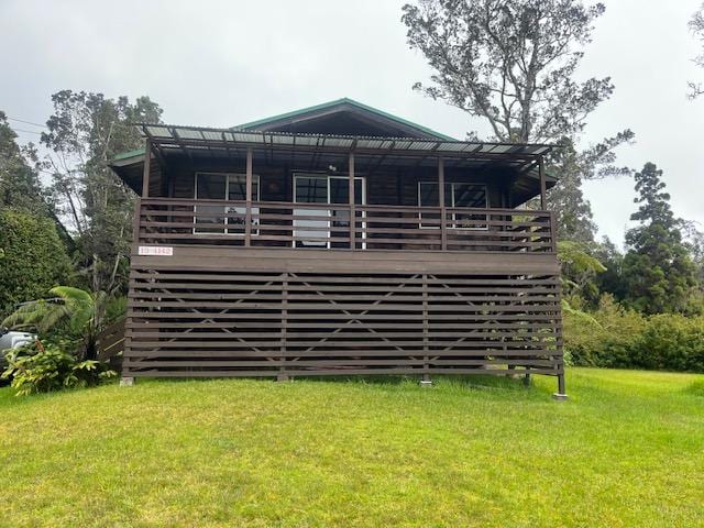 19-4142 Haunani Rd, Volcano, HI 96785 - back of property featuring a lawn and a wooden deck