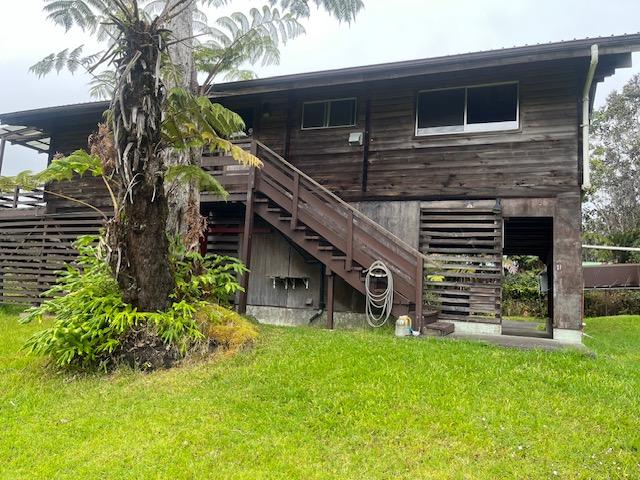 19-4142 Haunani Rd, Volcano, HI 96785 - back of house with a lawn and stairs