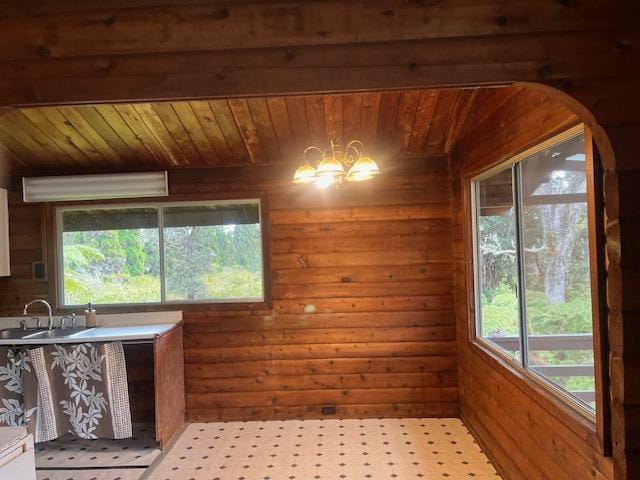 19-4142 Haunani Rd, Volcano, HI 96785 - unfurnished dining area featuring a sink, wood ceiling, wood walls, arched walkways, and a chandelier
