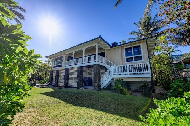 7324 Alealea Rd, Hanalei, HI 96714 - rear view of house with stairs and a yard