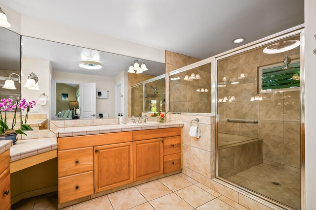 3675 Albert Rd, Princeville, HI 96722 - bathroom featuring tile patterned flooring, vanity, and a stall shower