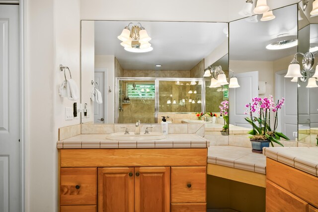 3675 Albert Rd, Princeville, HI 96722 - full bathroom with a shower stall, vanity, and a chandelier