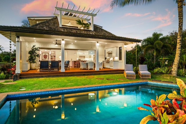 5086 Lau Nahele St, Koloa, HI 96756 - back of property at dusk with an outdoor pool and a yard