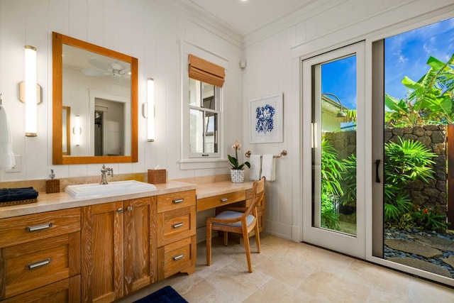 5086 Lau Nahele St, Koloa, HI 96756 - bathroom featuring ornamental molding, vanity, and ceiling fan