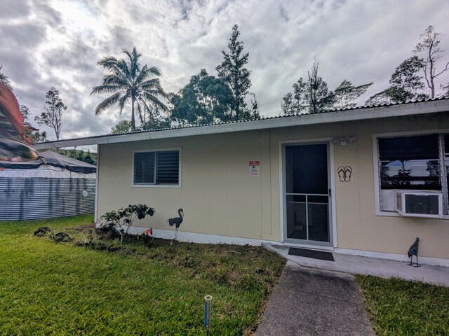 14-3426 Molokai Rd, Pahoa, HI 96778 - entrance to property featuring a yard and metal roof