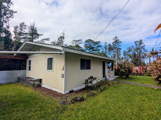 14-3426 Molokai Rd, Pahoa, HI 96778 - rear view of property featuring a yard