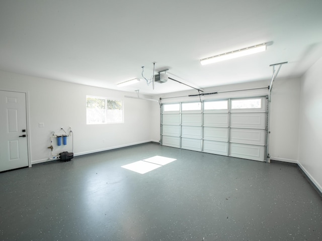 15-1703 5th Ave, Keaau, HI 96749 - garage with a garage door opener and baseboards