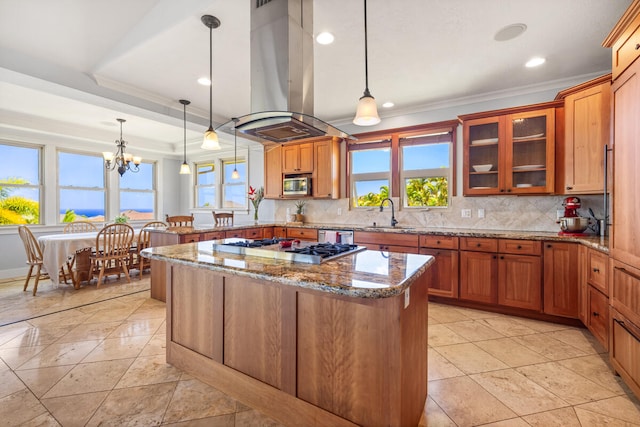 1167 Pua Melia St, Kalaheo, HI 96741 - kitchen featuring island range hood, stainless steel appliances, a peninsula, ornamental molding, and plenty of natural light