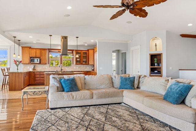 1167 Pua Melia St, Kalaheo, HI 96741 - living area featuring light wood-style floors, ceiling fan, arched walkways, lofted ceiling, and recessed lighting