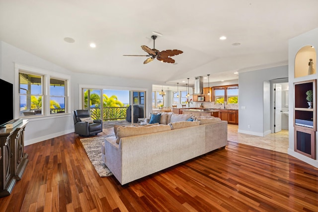 1167 Pua Melia St, Kalaheo, HI 96741 - living area with lofted ceiling, light wood-type flooring, ceiling fan, baseboards, and recessed lighting