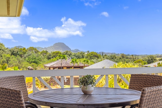 1167 Pua Melia St, Kalaheo, HI 96741 - wooden deck featuring a mountain view and outdoor dining space