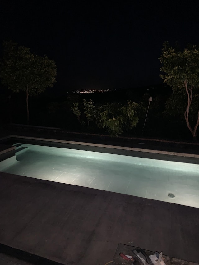 79-928 Mahiai Pl, Kealakekua, HI 96750 - pool at night featuring an empty pool