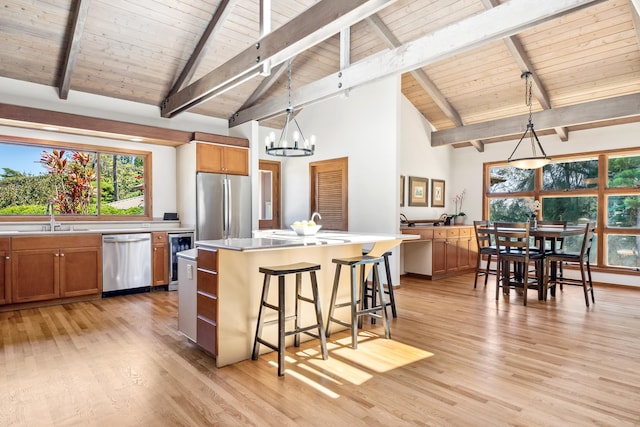 55-853 Kukini Pl, Hawi, HI 96719 - kitchen with stainless steel appliances, wood ceiling with exposed beams, a sink, beverage cooler, and a chandelier