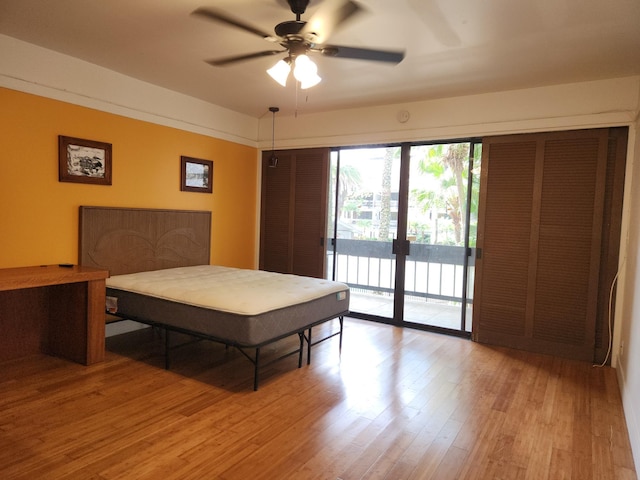 400 Hualani St Unit 3214, Hilo, HI 96720 - bedroom with access to exterior, wood finished floors, french doors, and ceiling fan