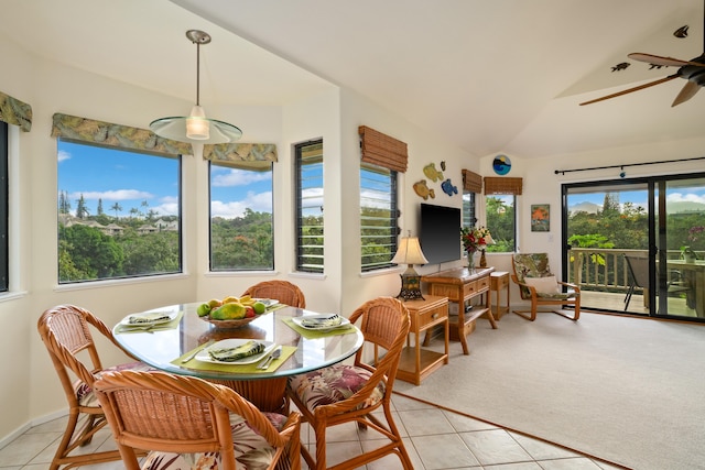 5451 Ka Haku Rd Unit 25, Princeville, HI 96722 - dining space with light tile patterned flooring, lofted ceiling, ceiling fan, and light colored carpet
