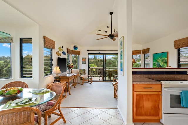 5451 Ka Haku Rd Unit 25, Princeville, HI 96722 - kitchen with white range, ceiling fan, vaulted ceiling, light tile patterned floors, and light colored carpet
