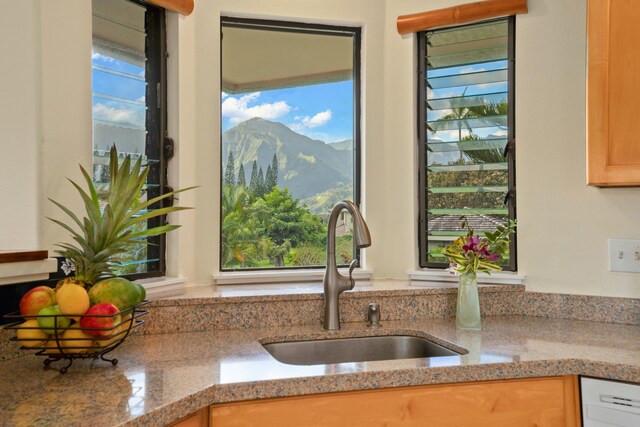 5451 Ka Haku Rd Unit 25, Princeville, HI 96722 - kitchen with a sink, a mountain view, dishwashing machine, and light stone counters