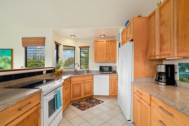 5451 Ka Haku Rd Unit 25, Princeville, HI 96722 - kitchen featuring white appliances, a sink, healthy amount of natural light, and light tile patterned floors