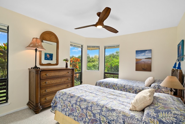 5451 Ka Haku Rd Unit 25, Princeville, HI 96722 - bedroom featuring light carpet, baseboards, and a ceiling fan