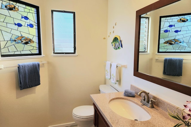 5451 Ka Haku Rd Unit 25, Princeville, HI 96722 - half bathroom featuring toilet, vanity, and baseboards