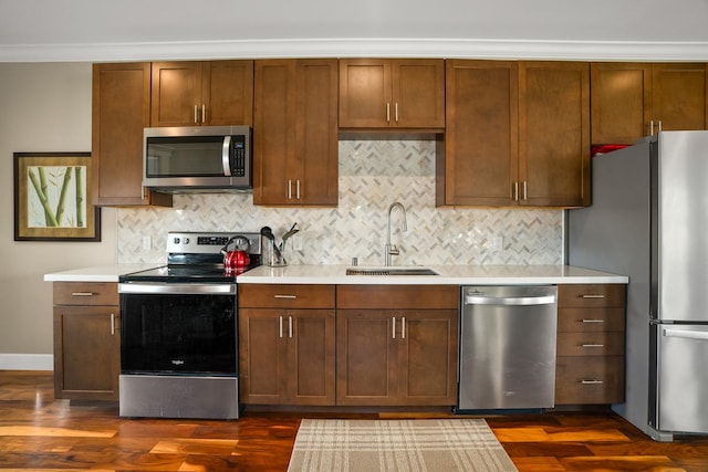 1182 Milia St, Kalaheo, HI 96741 - kitchen featuring stainless steel appliances, a sink, light countertops, ornamental molding, and tasteful backsplash