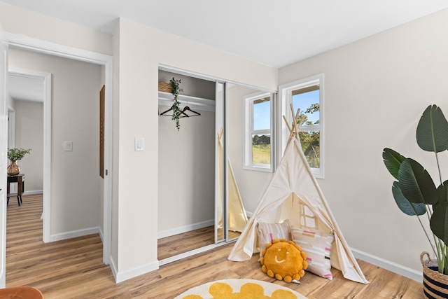 1577 Maunakai St, Hilo, HI 96720 - playroom with light wood-style floors and baseboards
