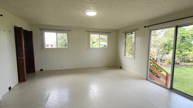 90 Palua Loop, Hilo, HI 96720 - empty room with baseboards and a textured ceiling