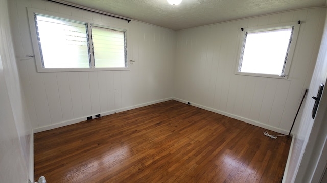 90 Palua Loop, Hilo, HI 96720 - spare room featuring hardwood / wood-style floors, a textured ceiling, and baseboards