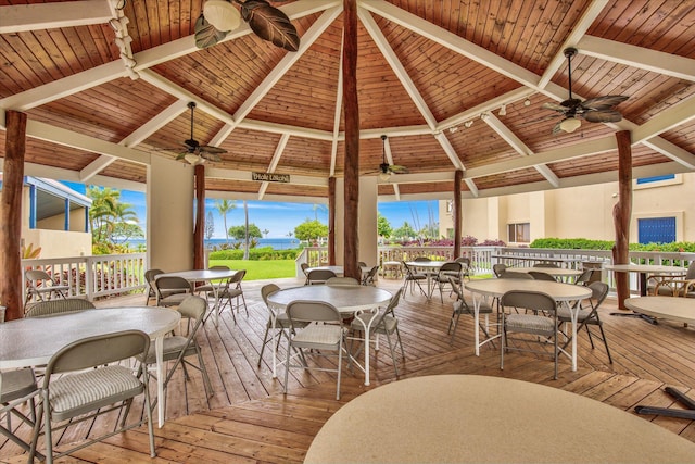 78-6842 Alii Dr Unit 11102, Kailua-Kona, HI 96740 - wooden terrace with a ceiling fan, outdoor dining area, and a gazebo