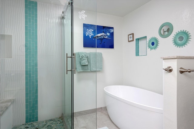 78-6842 Alii Dr Unit 11102, Kailua-Kona, HI 96740 - bathroom featuring tiled shower, a freestanding tub, and tile patterned flooring