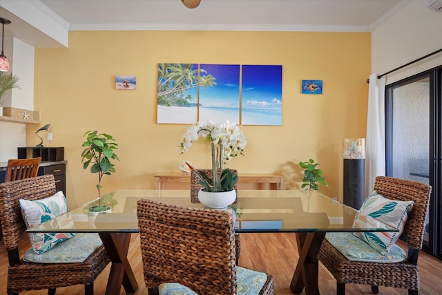 78-6842 Alii Dr Unit 11102, Kailua-Kona, HI 96740 - dining area with wood finished floors and ornamental molding