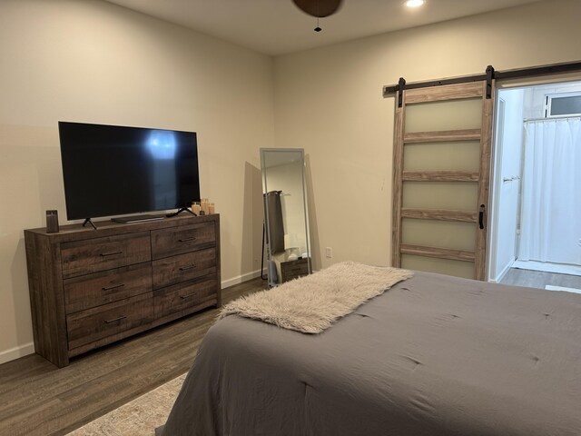 16-1844 34th Ave, Keaau, HI 96749 - bedroom featuring dark wood-type flooring, baseboards, a barn door, and recessed lighting