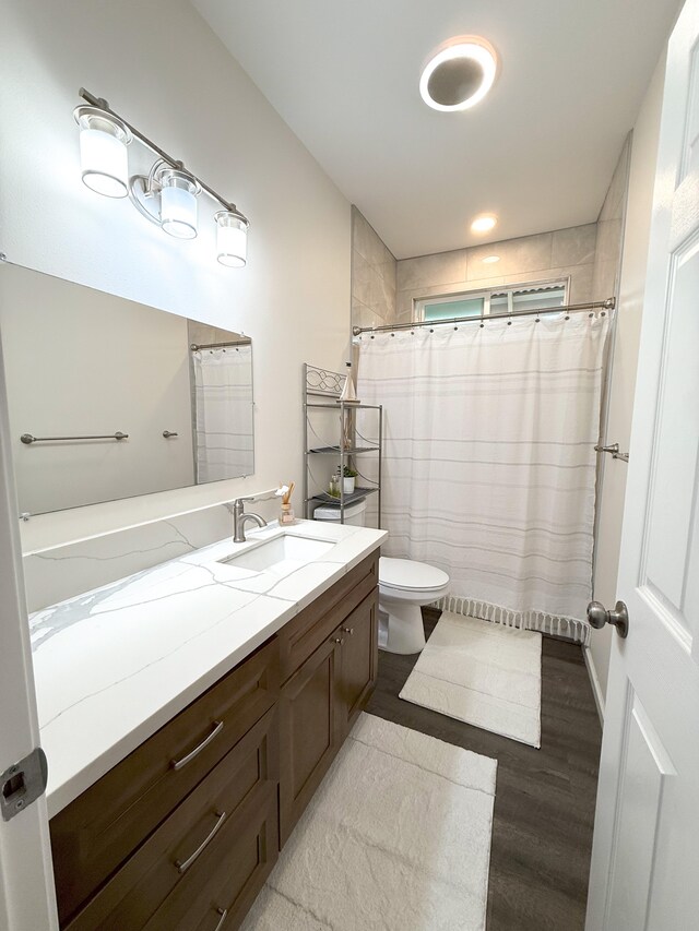 16-1844 34th Ave, Keaau, HI 96749 - full bathroom featuring vanity, toilet, wood finished floors, and a shower with curtain