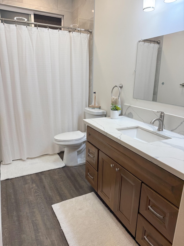 16-1844 34th Ave, Keaau, HI 96749 - bathroom with wood finished floors, toilet, vanity, and a shower with curtain