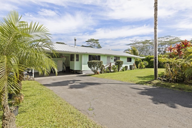 15-1477 17th Ave, Keaau, HI 96749 - view of front of property with driveway, a front yard, metal roof, and an attached carport