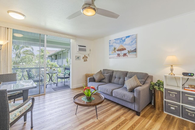 75-5776 Kuakini Hwy Unit 335, Kailua-Kona, HI 96740 - living area featuring light wood finished floors, ceiling fan, and baseboards