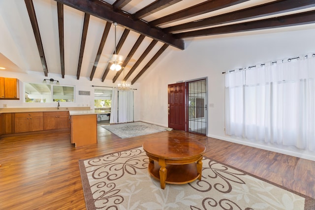74-5009 Kealakaa St, Kailua-Kona, HI 96740 - living area with wood finished floors, a chandelier, and baseboards