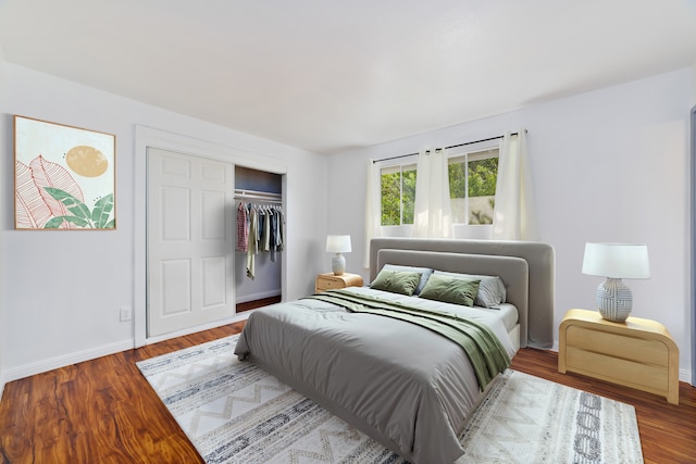 74-5009 Kealakaa St, Kailua-Kona, HI 96740 - bedroom with baseboards, a closet, and wood finished floors