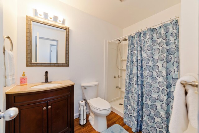 74-5009 Kealakaa St, Kailua-Kona, HI 96740 - full bathroom featuring toilet, vanity, wood finished floors, and a shower with curtain