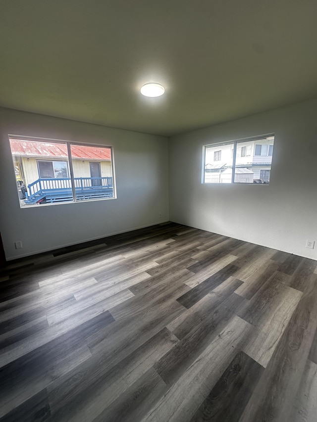 199 Kehaulani St Unit 3, Hilo, HI 96720 - spare room with healthy amount of natural light and dark wood-style flooring