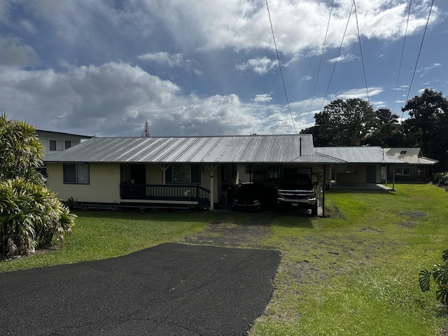 199 Kehaulani St Unit 3, Hilo, HI 96720 - view of front of home featuring driveway, a front lawn, metal roof, and a carport