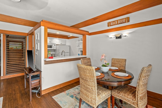 2253 Poipu Rd Unit 411, Koloa, HI 96756 - dining room featuring baseboards, dark wood-style floors, beam ceiling, and recessed lighting