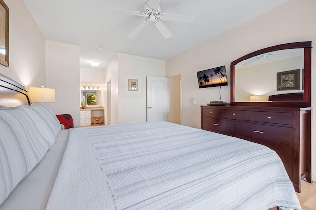 1831 Poipu Rd Unit 513, Koloa, HI 96756 - bedroom featuring a ceiling fan, ensuite bath, and light wood-style flooring
