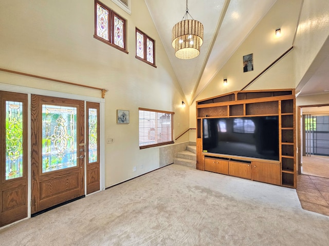 726-A Waianuenue Ave, Hilo, HI 96720 - carpeted entrance foyer featuring a chandelier, high vaulted ceiling, healthy amount of natural light, and stairway