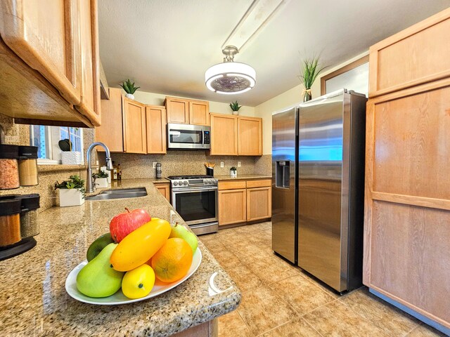 726-A Waianuenue Ave, Hilo, HI 96720 - kitchen with stainless steel appliances, a sink, light brown cabinetry, tasteful backsplash, and light tile patterned floors