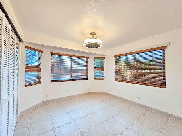 726-A Waianuenue Ave, Hilo, HI 96720 - tiled empty room with plenty of natural light and baseboards